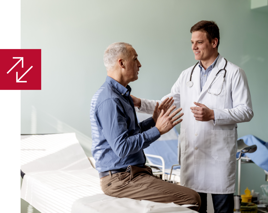 doctor talking to a patient in an exam room